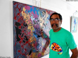 The Martinican plastic artist, Alain Phoébé Caprice, in front of his work called "Èskarpen" (Pumps). Photo: Évelyne Chaville